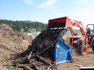 slg-78 Screening dirt at job site.